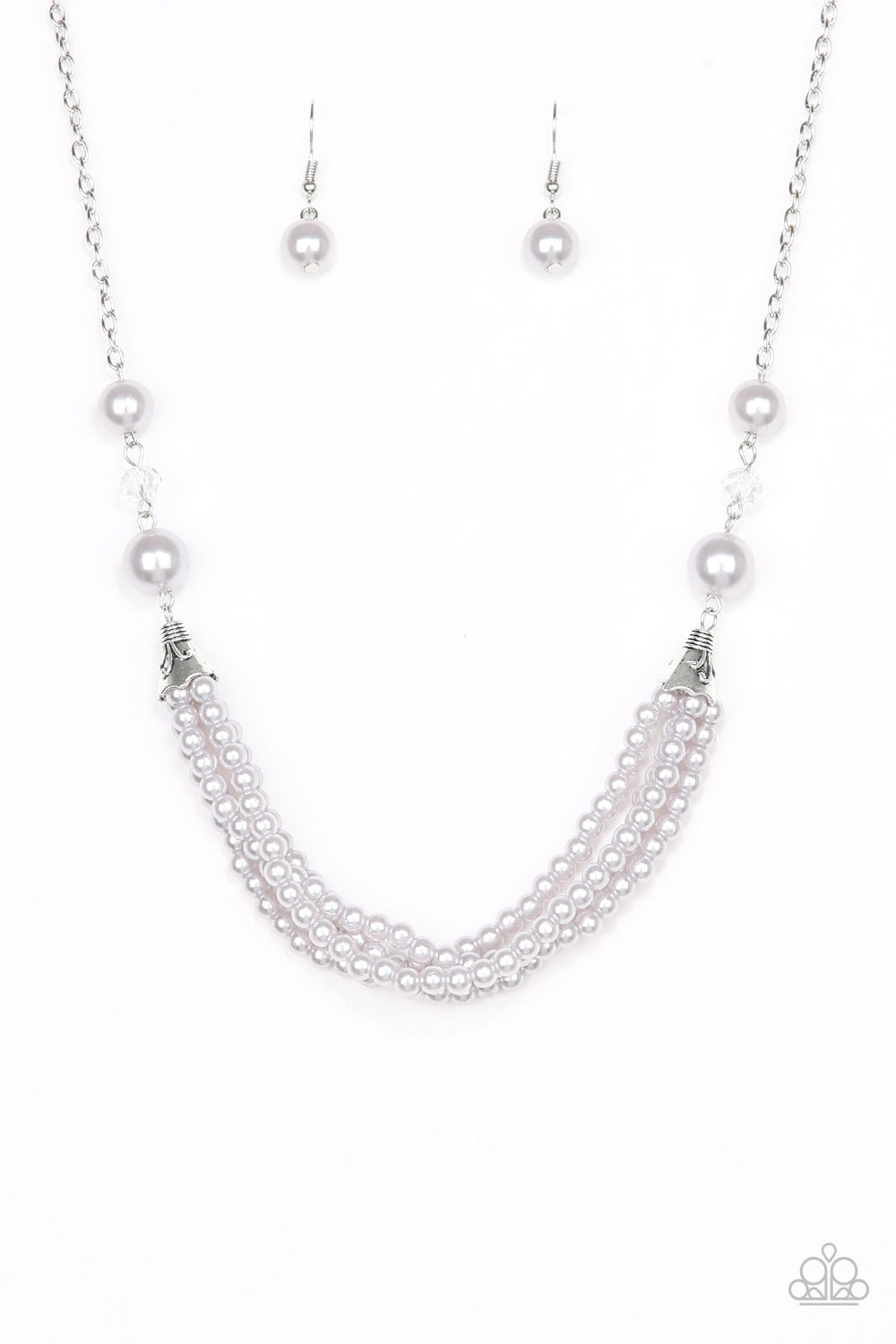 Oversized silver pearls and crystal-like beads give way to layers of beaded pearl strands