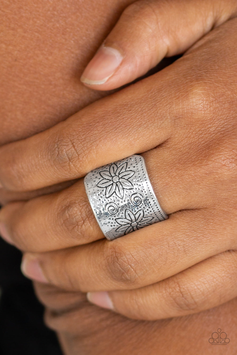 floral detail, a thick silver band