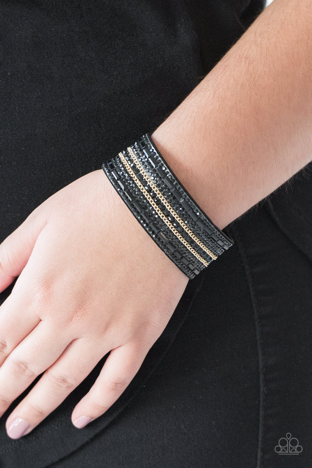 round and edgy emerald style cuts, glittery black rhinestones and glistening gold chains 