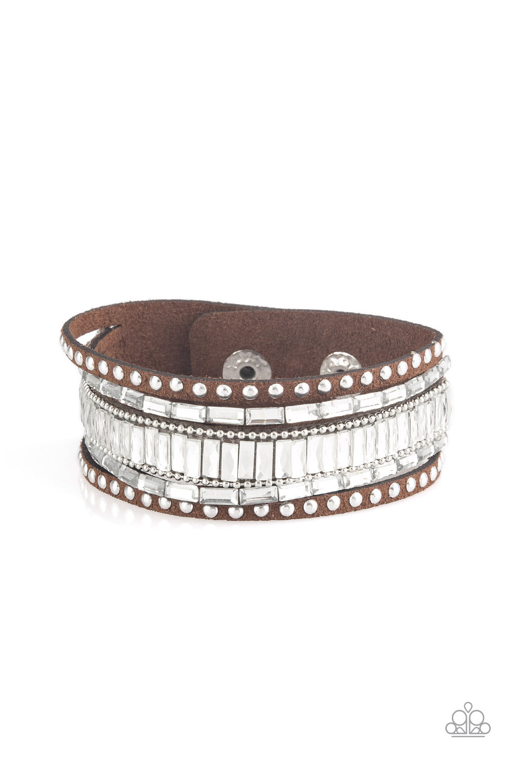 Shiny silver studs, dainty silver ball chains, and edgy white emerald-cut rhinestones race along a spliced brown suede band for a rock star look.