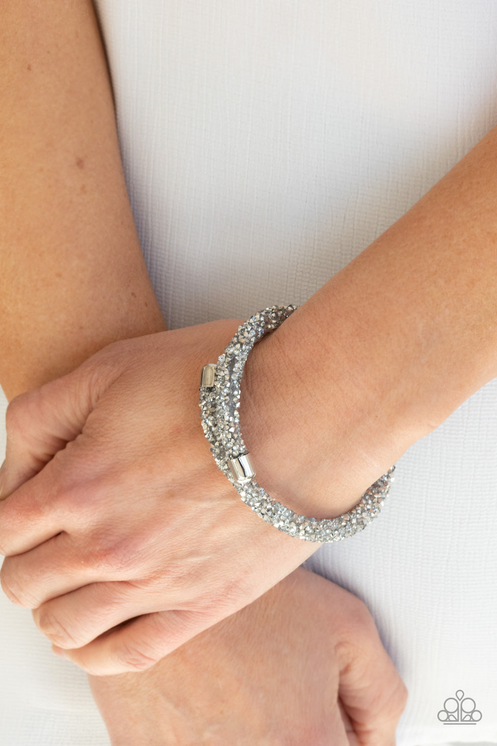 metallic flecked and glassy white rhinestones