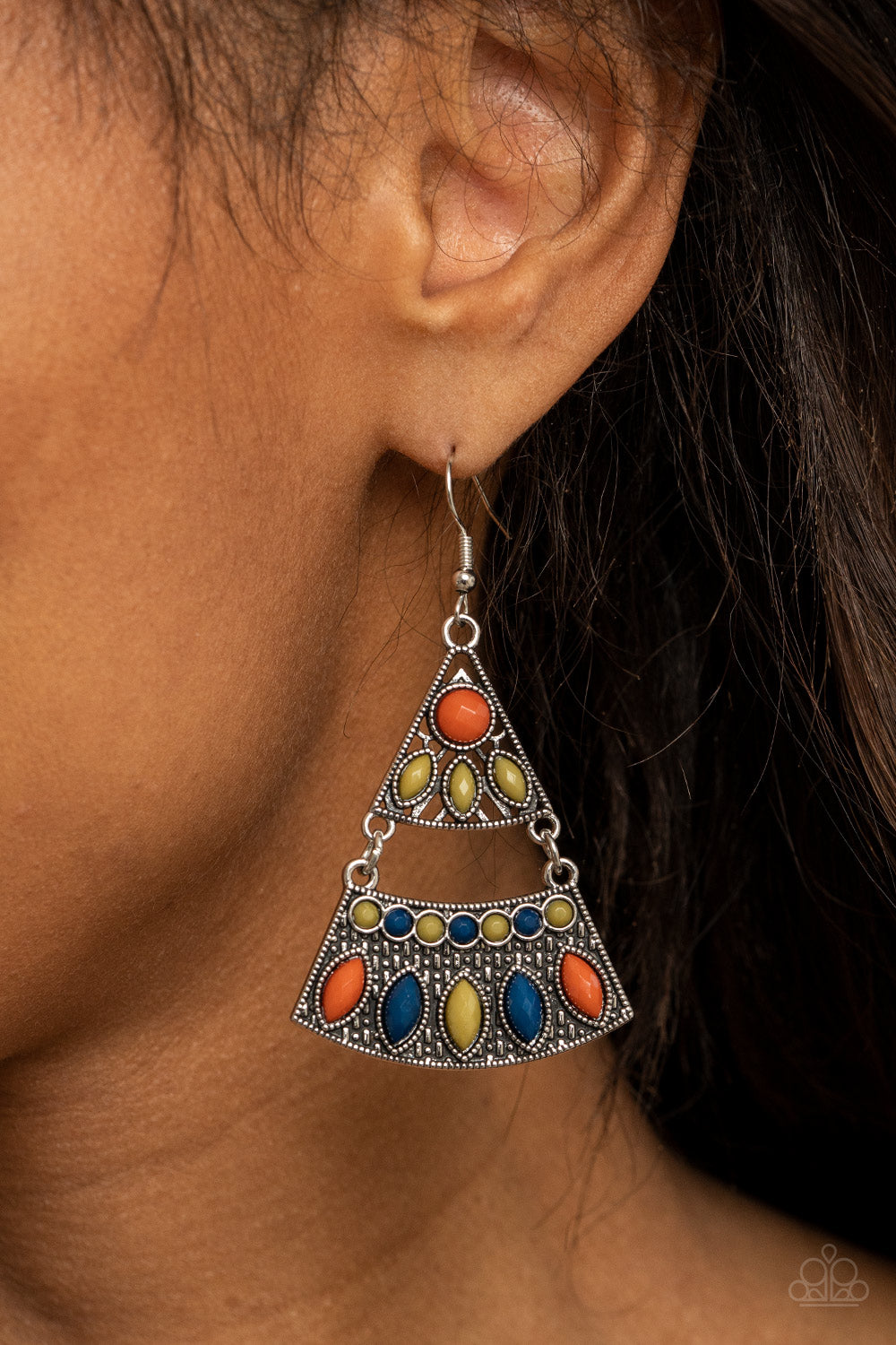 Mismatched blue, green, and Rust colored beads adorn the fronts of studded triangular and rectangular silver frames 