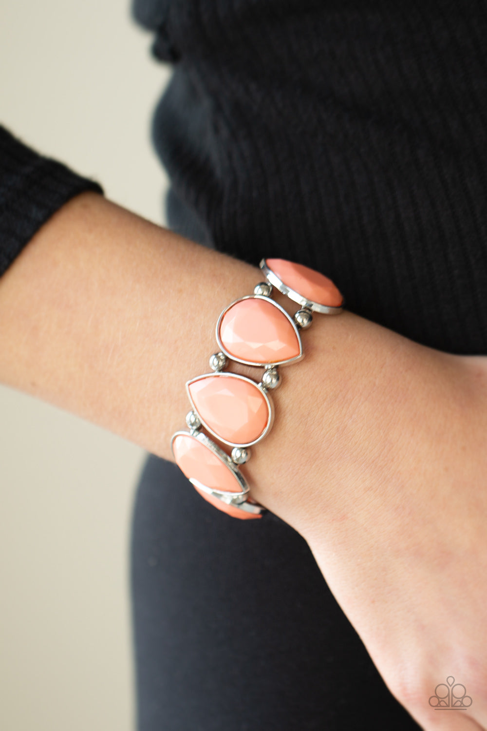 classic silver beads, faceted coral teardrop frames alternate right side up and upside down along a stretchy band