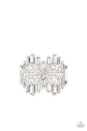 Staggered rows of emerald cut rhinestones flare out from the top and bottom of an explosion of classic white rhinestones