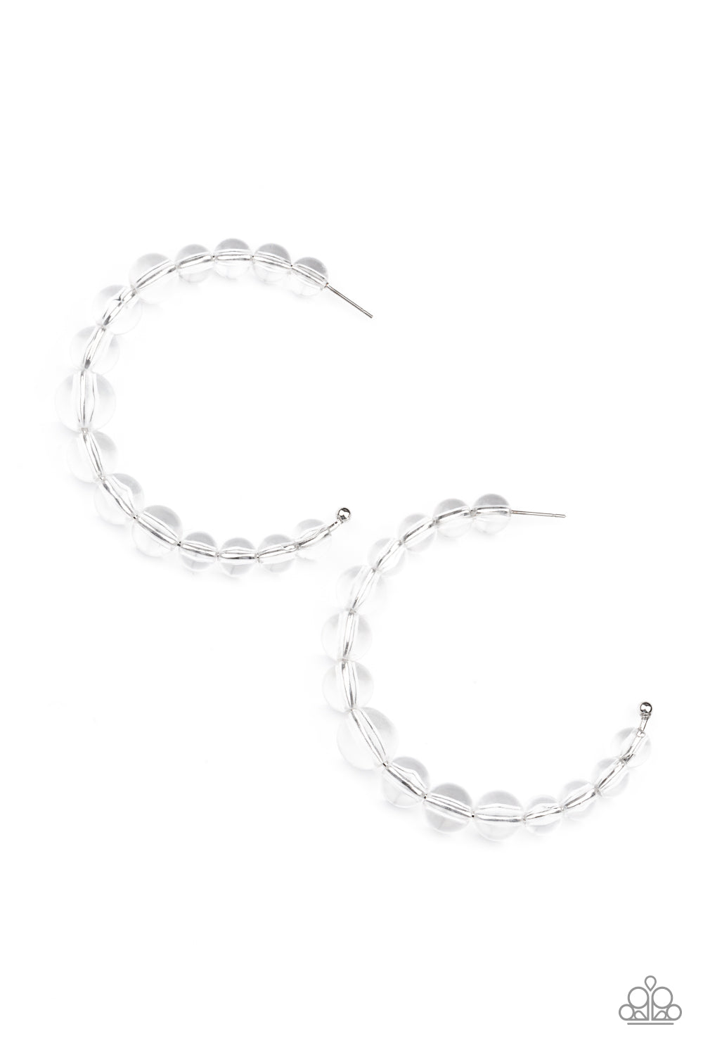 a glassy collection of white beads are threaded along an oversized hoop 