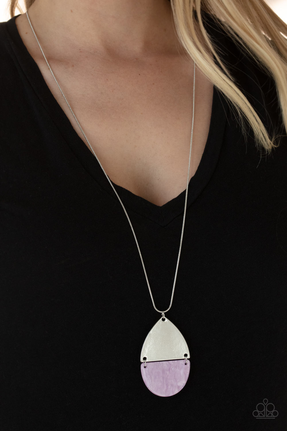 purple shell-like half moon frame links to a shiny silver triangular plate at the bottom of a lengthened silver snake chain