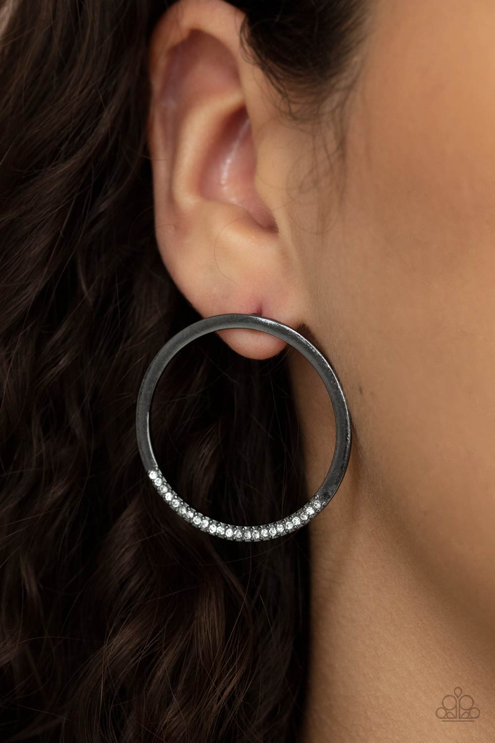 As if dipped in glitter, the bottom of a flat gunmetal hoop is encrusted in dainty white rhinestones for a classic shimmer. 
