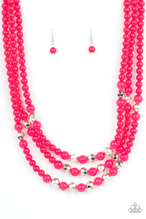 polished pink beads, faceted silver beads, and opaque pink beads are threaded along invisible wires