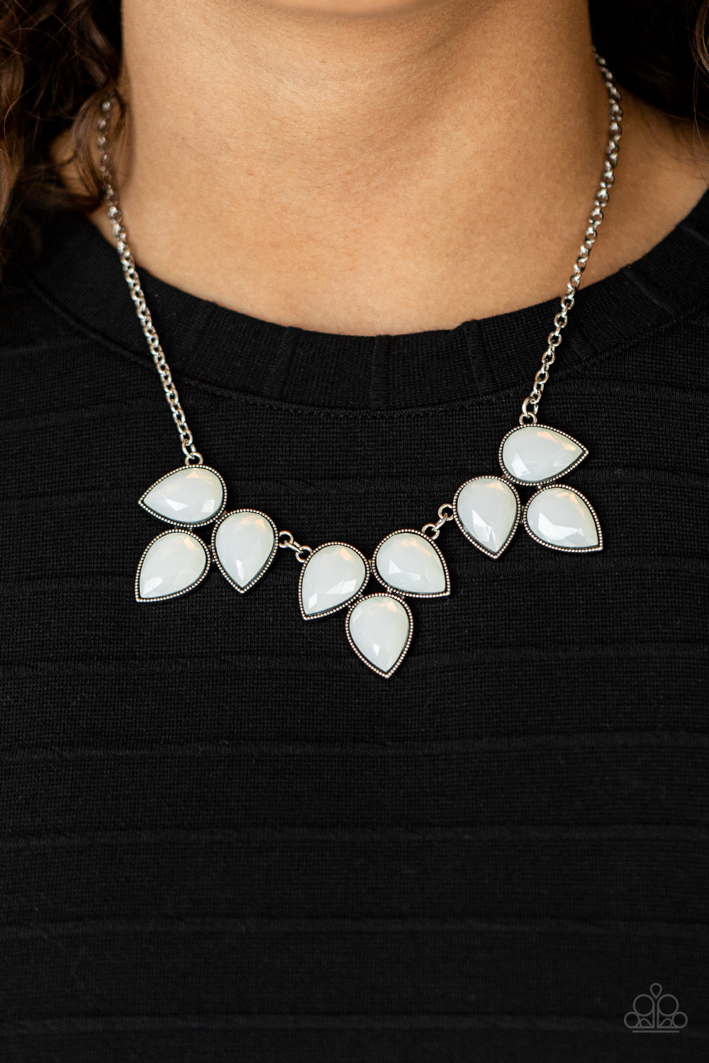 dewy white teardrop beads encased in studded antiqued silver casings