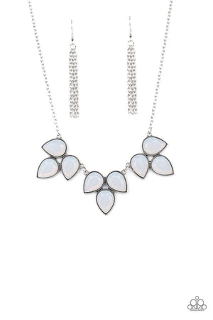 dewy white teardrop beads encased in studded antiqued silver casings