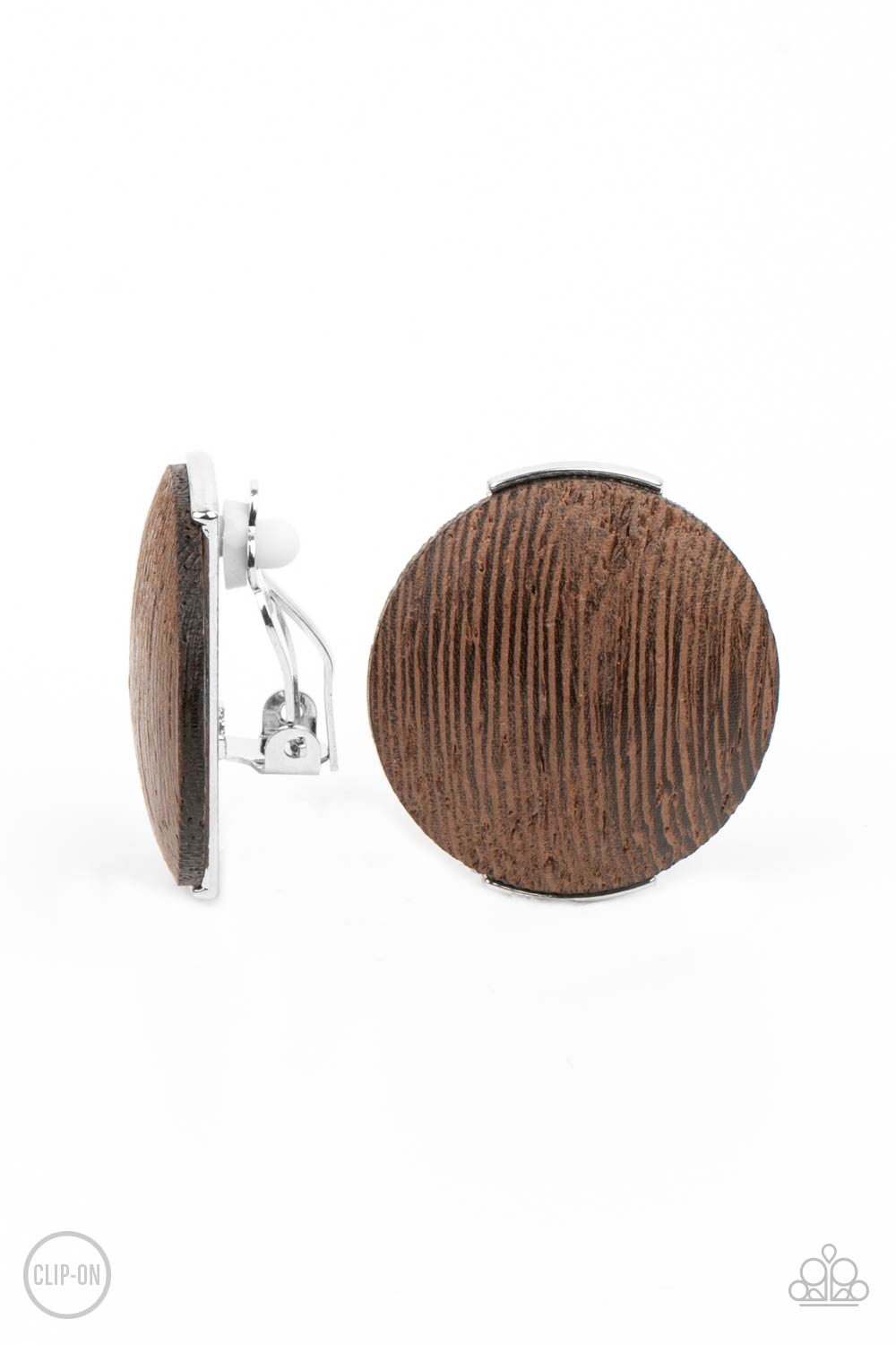 oversized brown wooden disc is fitted in place between a silver frame