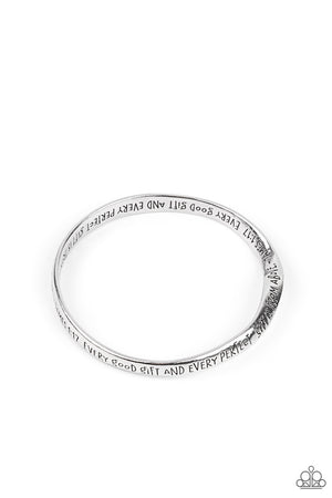 a subtle twist, a silver bangle is engraved in the biblical passage, "Every good gift and every perfect gift is from above