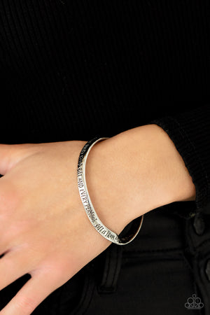 a subtle twist, a silver bangle is engraved in the biblical passage, "Every good gift and every perfect gift is from above