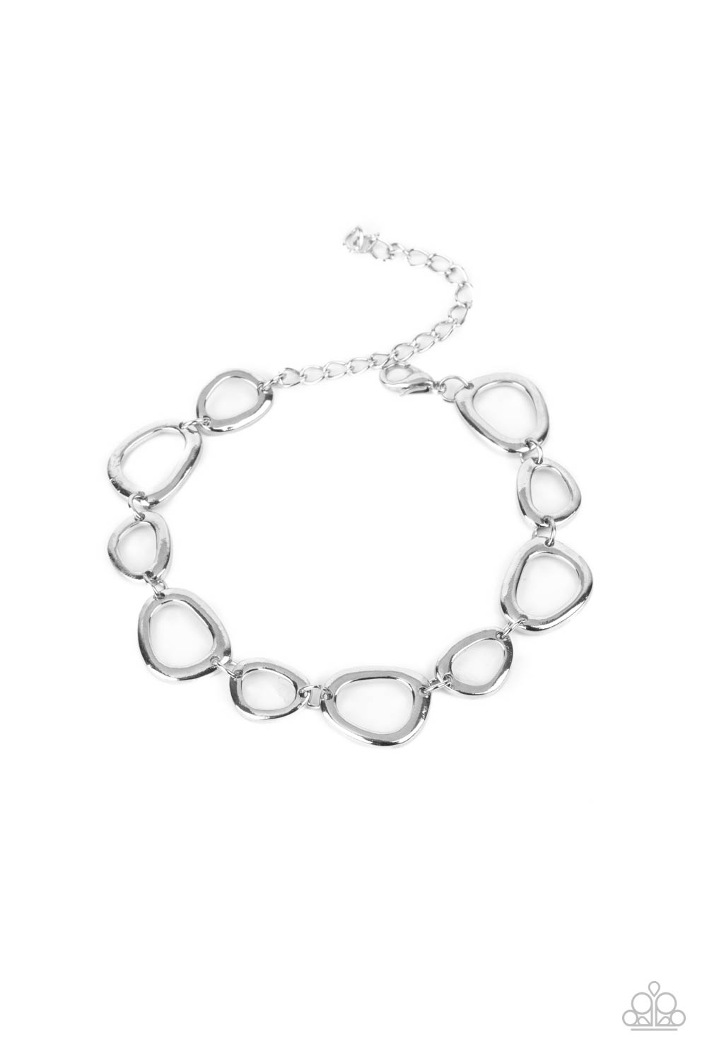 irregular shaped silver rings link together and make their way around the wrist