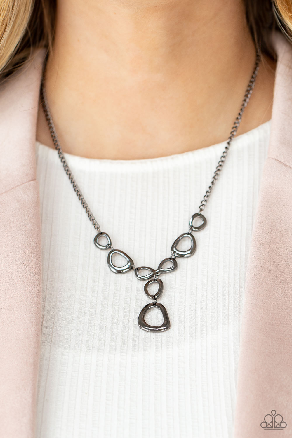 Irregular shaped gunmetal rings connect to a gunmetal chain