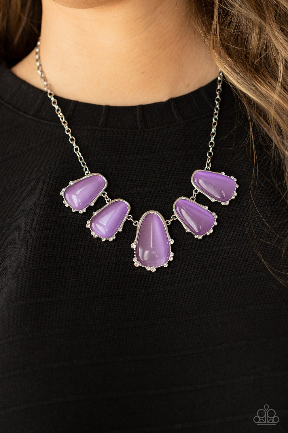 asymmetrical Lavender cat’s eye stone teardrops are encased inside imperfect silver frames
