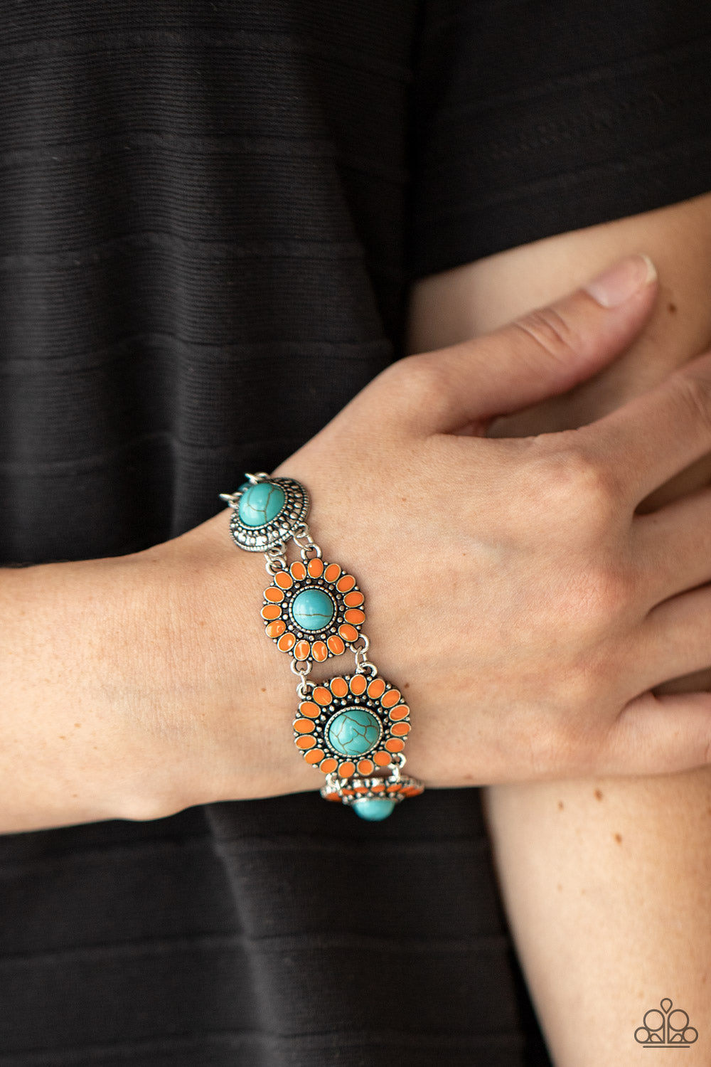 refreshing turquoise stone centers, studded silver frames double-link with Marigold petaled floral frames
