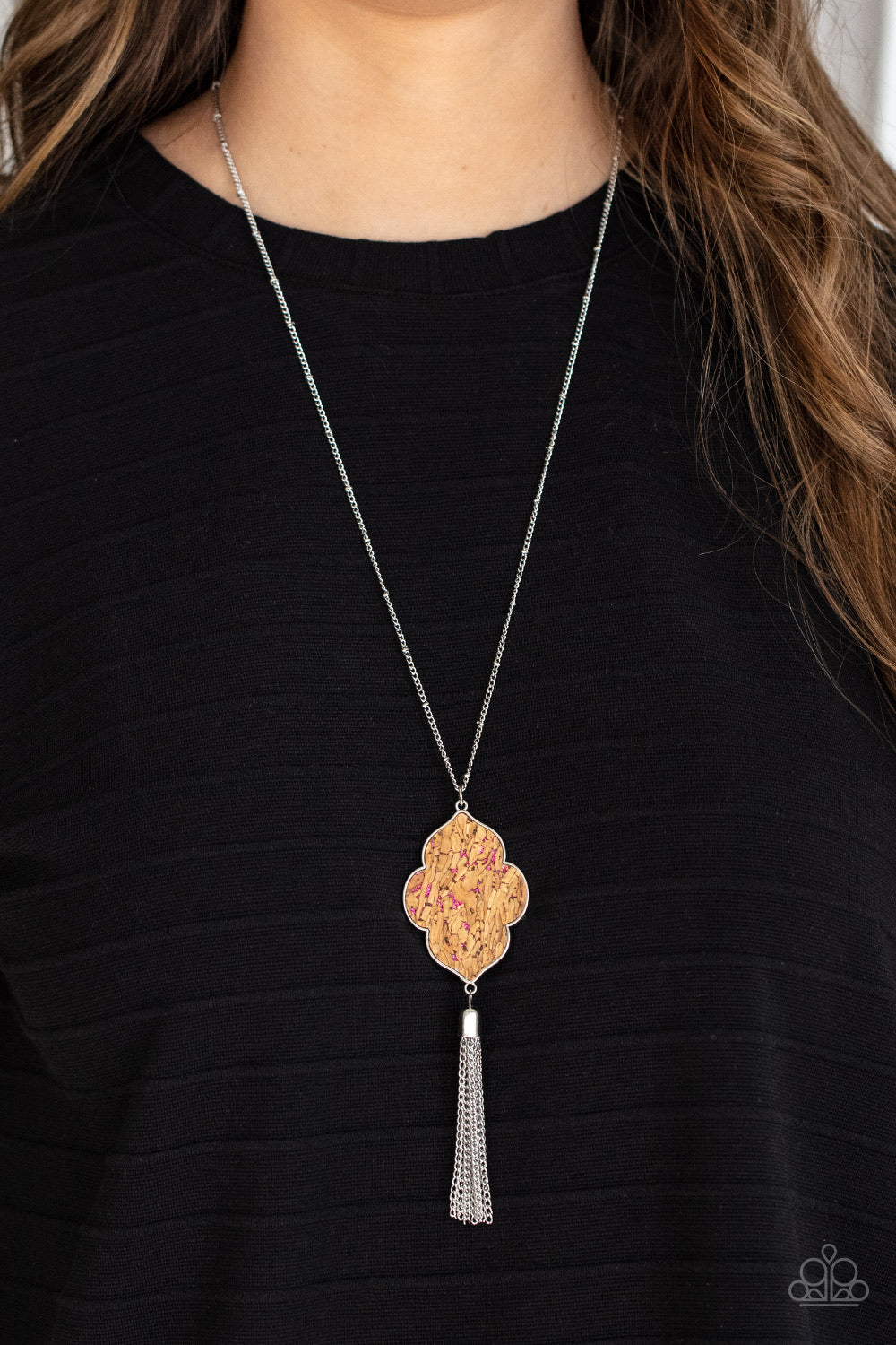 glittery pink sparkles, a scalloped cork frame is pressed into a sleek silver frame at the bottom of a dainty silver satellite chain
