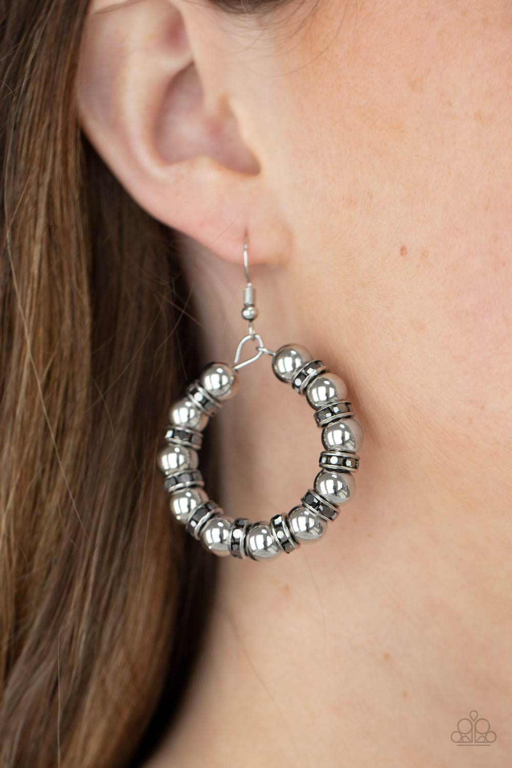 Glistening silver beads and iridescent hematite encrusted rings alternate along a dainty wire hoop