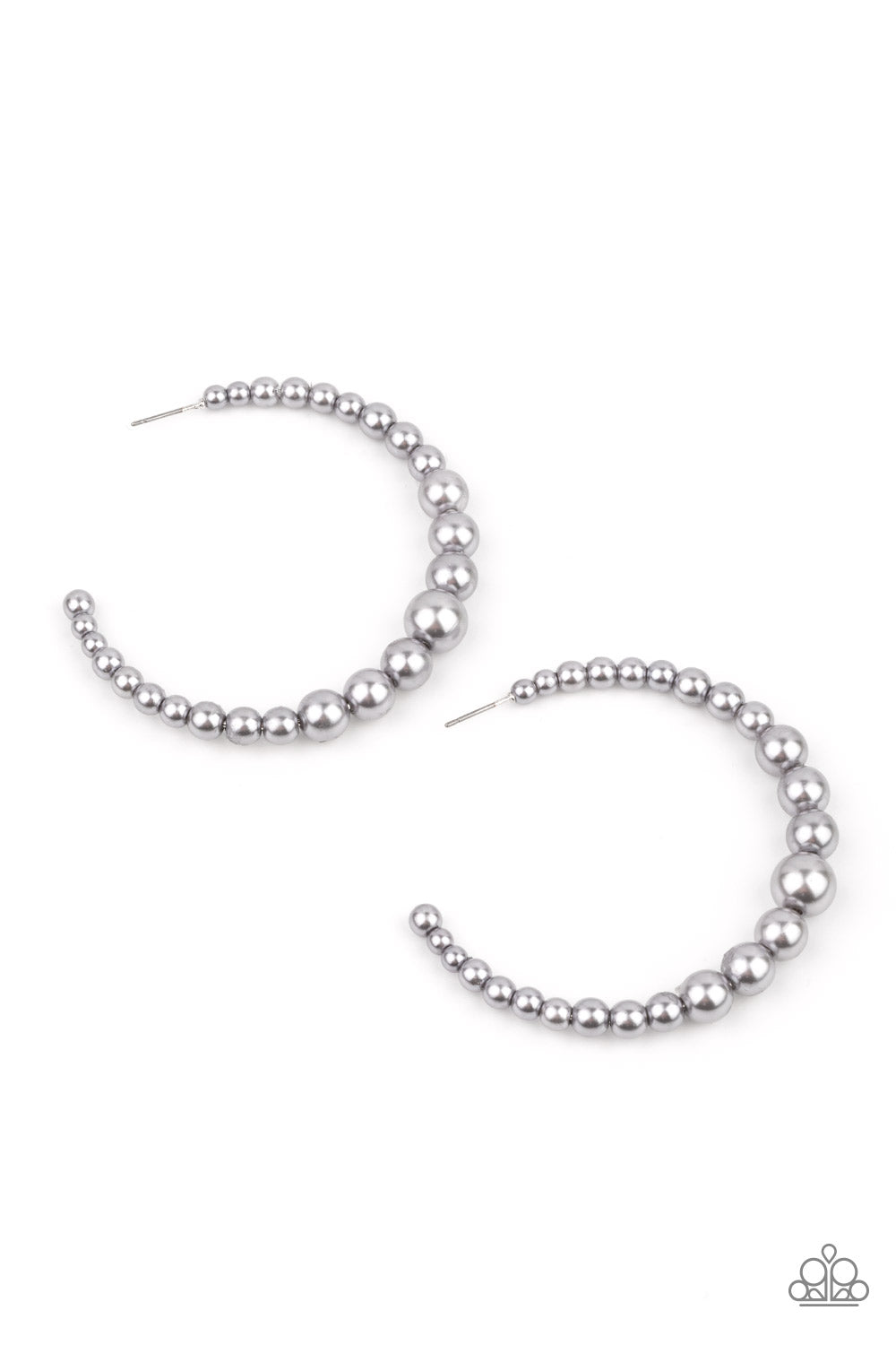 Gradually increasing in size at the center, a classic row of pearly silver beads are threaded along an oversized hoop for a posh finish.