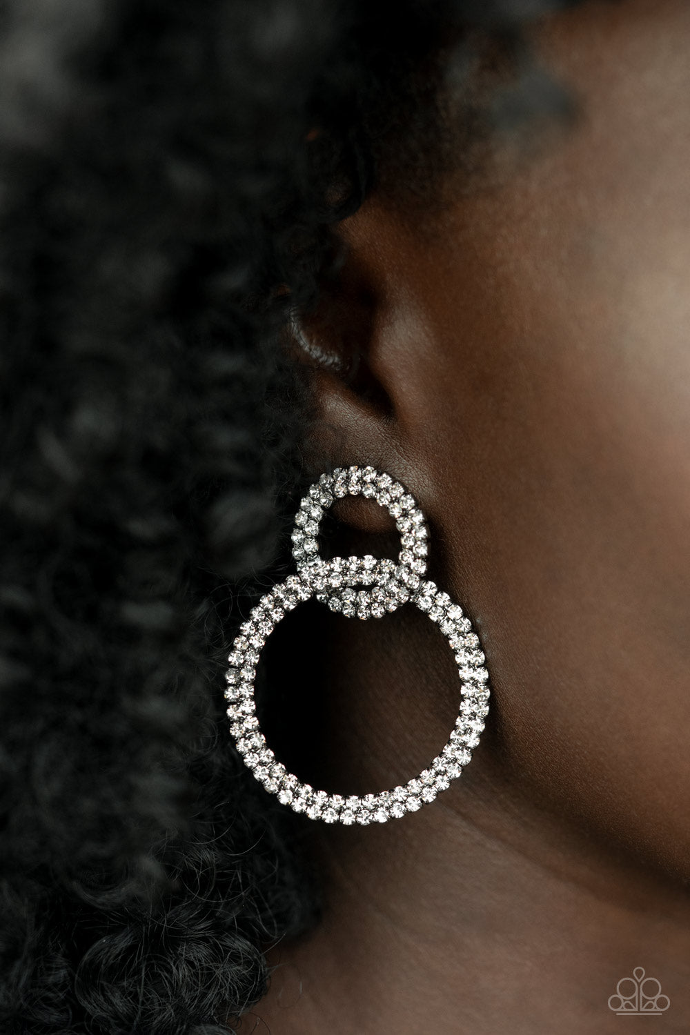 Rows of sparkly white rhinestones encircle into two interconnected hoops, creating a jaw-dropping lure