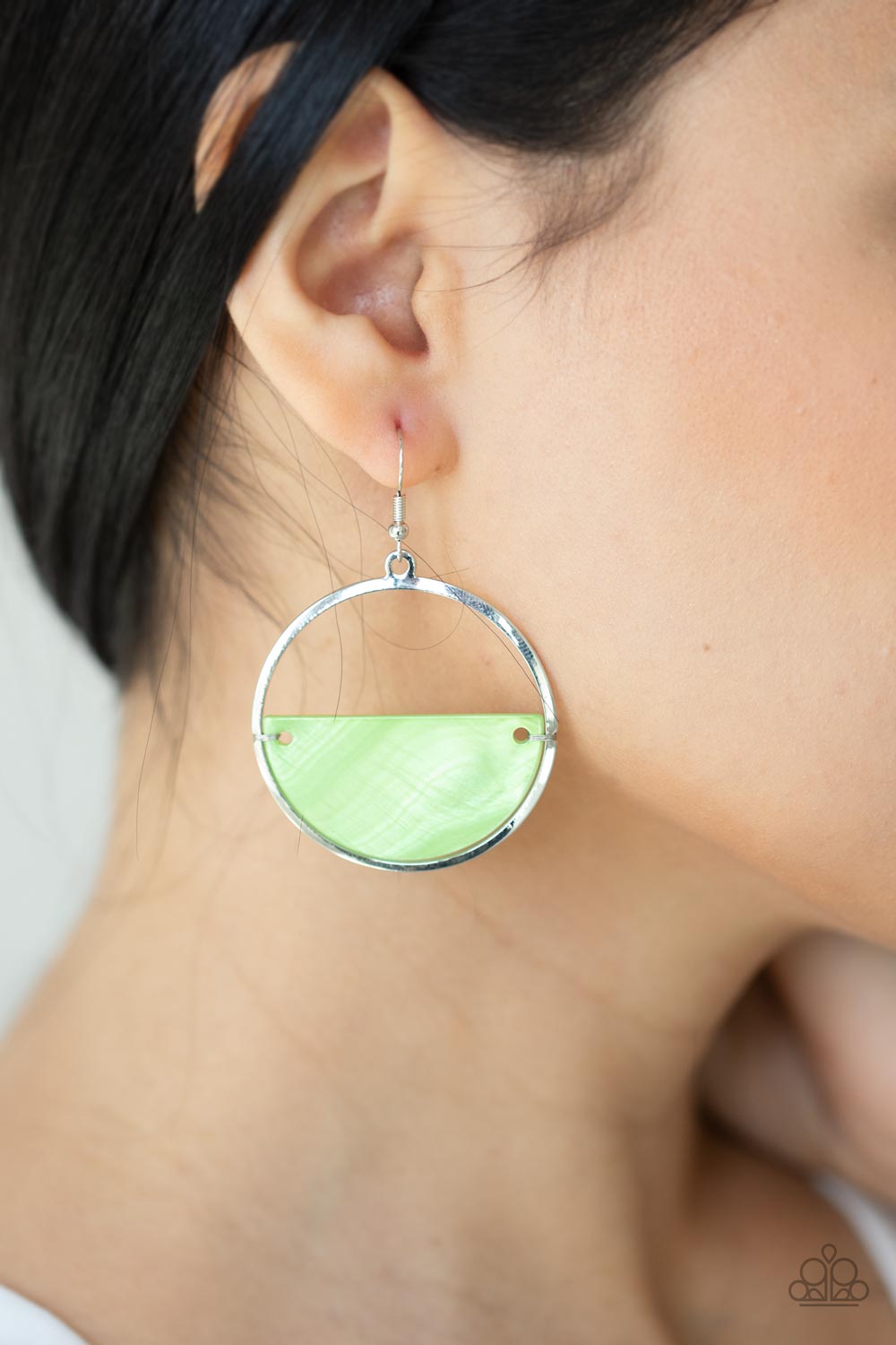  iridescent shimmer, a green half moon shell attaches to the bottom of a flat silver hoop