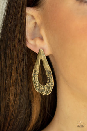 warped brass teardrop frame is hammered in rustic details,