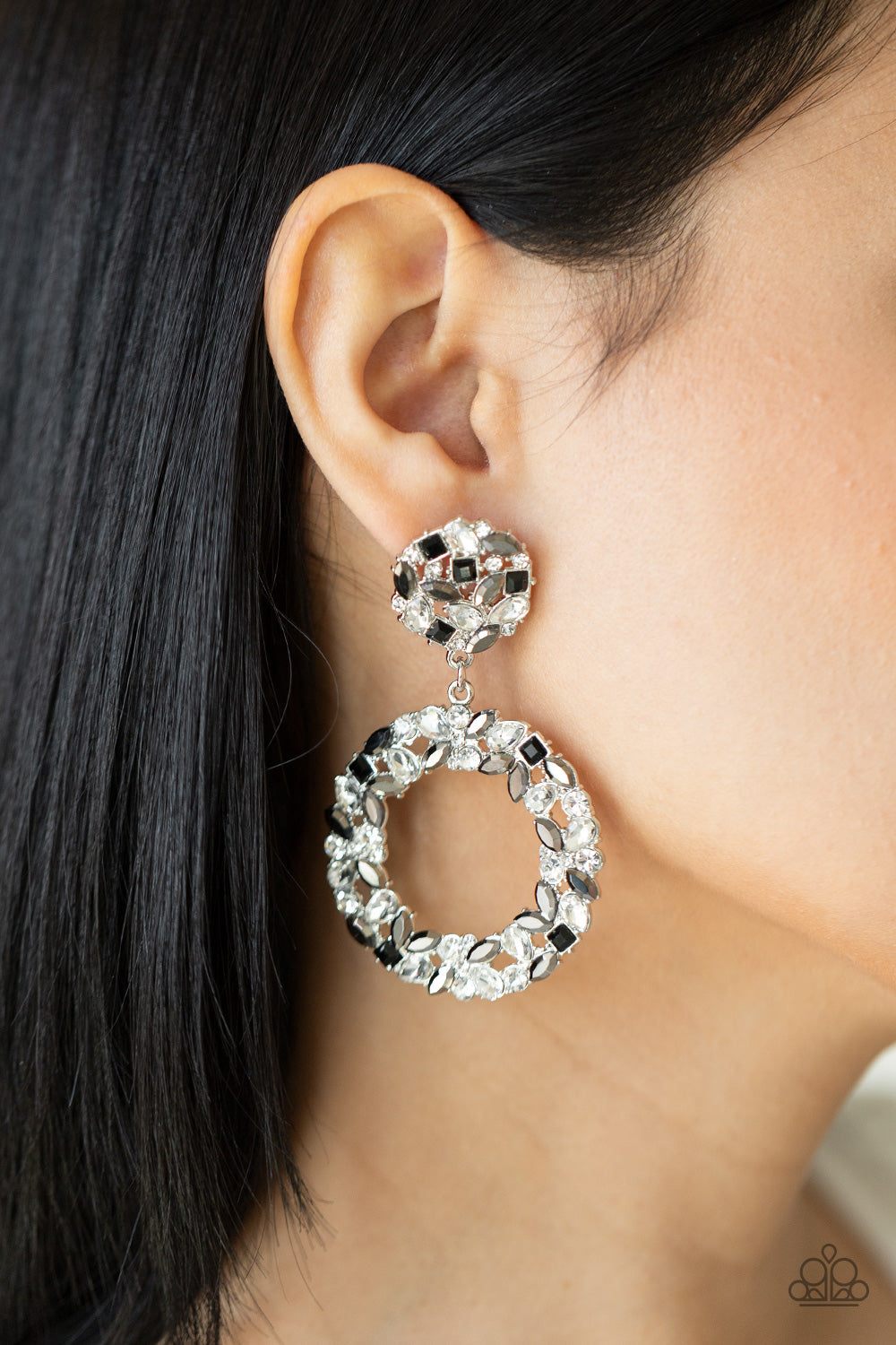 sparkly wreath of marquise cut hematite, black square, white teardrop, and classic white rhinestones delicately swing from the bottom of a matching round frame