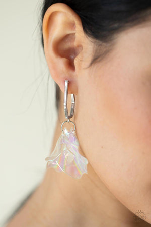cluster of iridescent acrylic petals swing from the bottom of a dainty silver geometric hoop