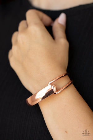flat shiny copper bar and airy shiny copper frame delicately overlap around the wrist