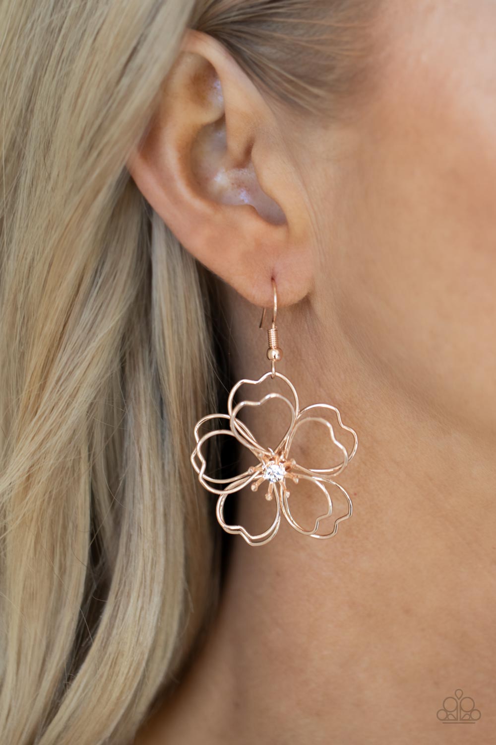 Layers of heart-shaped petals molded from shiny rose gold wire create an airy three-dimensional flower