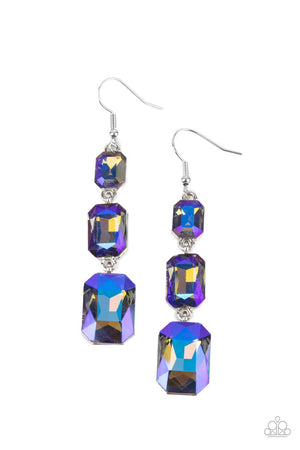 dazzling blue and gold UV shimmer, a trio of emerald-cut gems in graduating sizes