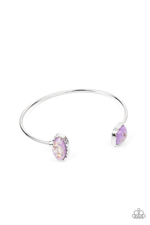 iridescent shell-like pieces are encased inside two mismatched glassy purple beads 