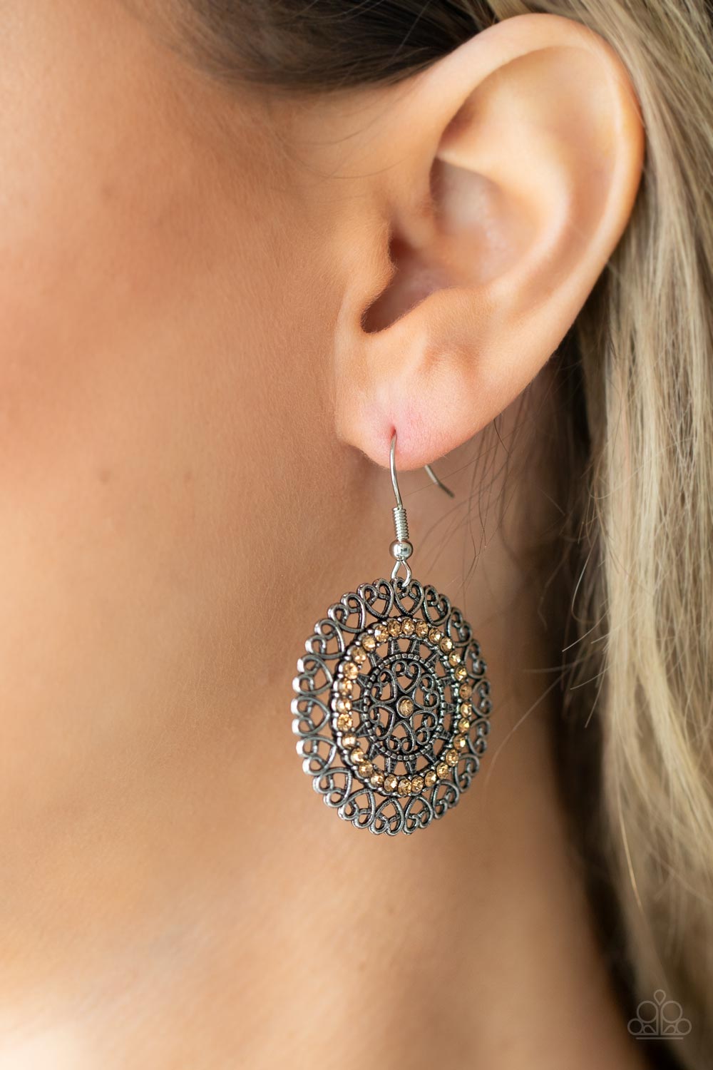 Silver heart shaped filigree frames spin into an enchanting display