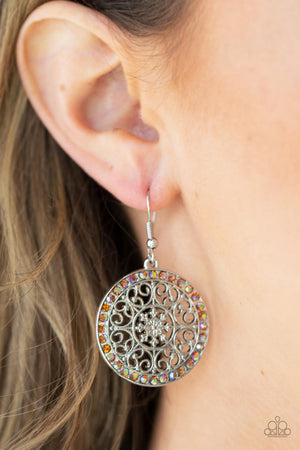 Infused with a border of iridescent orange rhinestones, studded silver heart shape filigree fans out from a decorative silver floral center for a whimsical look. Earring attaches to a standard fishhook fitting.
