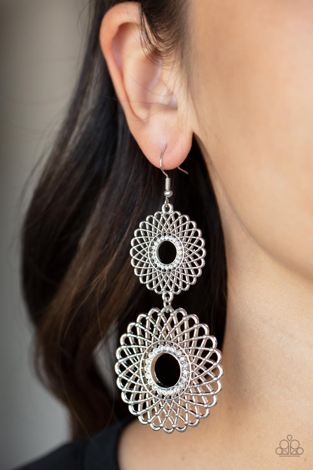 Airy silver petals infinitely overlap into two dizzying silver floral medallions