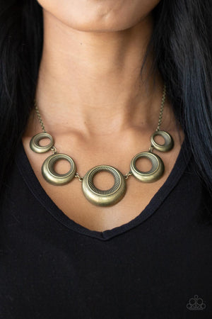 ntiqued collection of beveled brass hoops gradually increase in size as they link below the collar for a bold metallic look