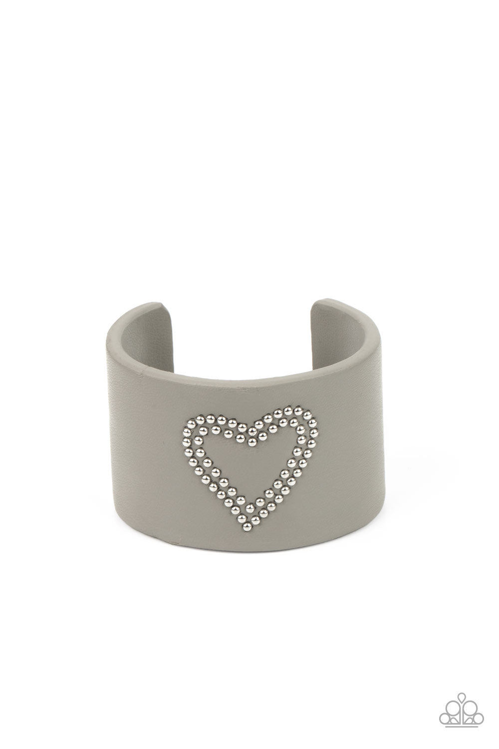 The center of an Ultimate Gray leather cuff is studded in a charming heart pattern, creating a rustically romantic look around the wrist.