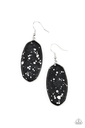 Speckled with white accents, a flat black stone is pressed into a sleek silver fitting for a colorfully seasonal look