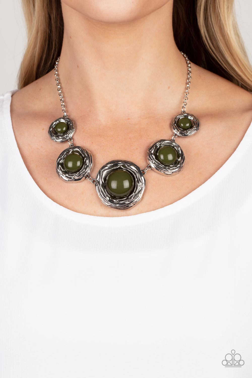 Gradually increasing in size, a bubbly collection of oversized Olive Branch beads adorn the centers of folds of silver buds below the collar