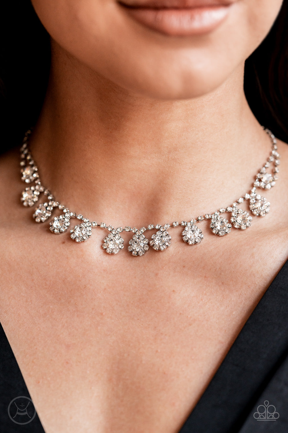 dainty strand of glittery white rhinestones encircle solitaire white rhinestones around the neck