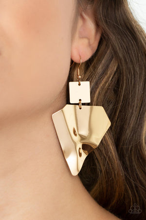 A warped gold triangular plate swings from the bottom of a flat gold square frame