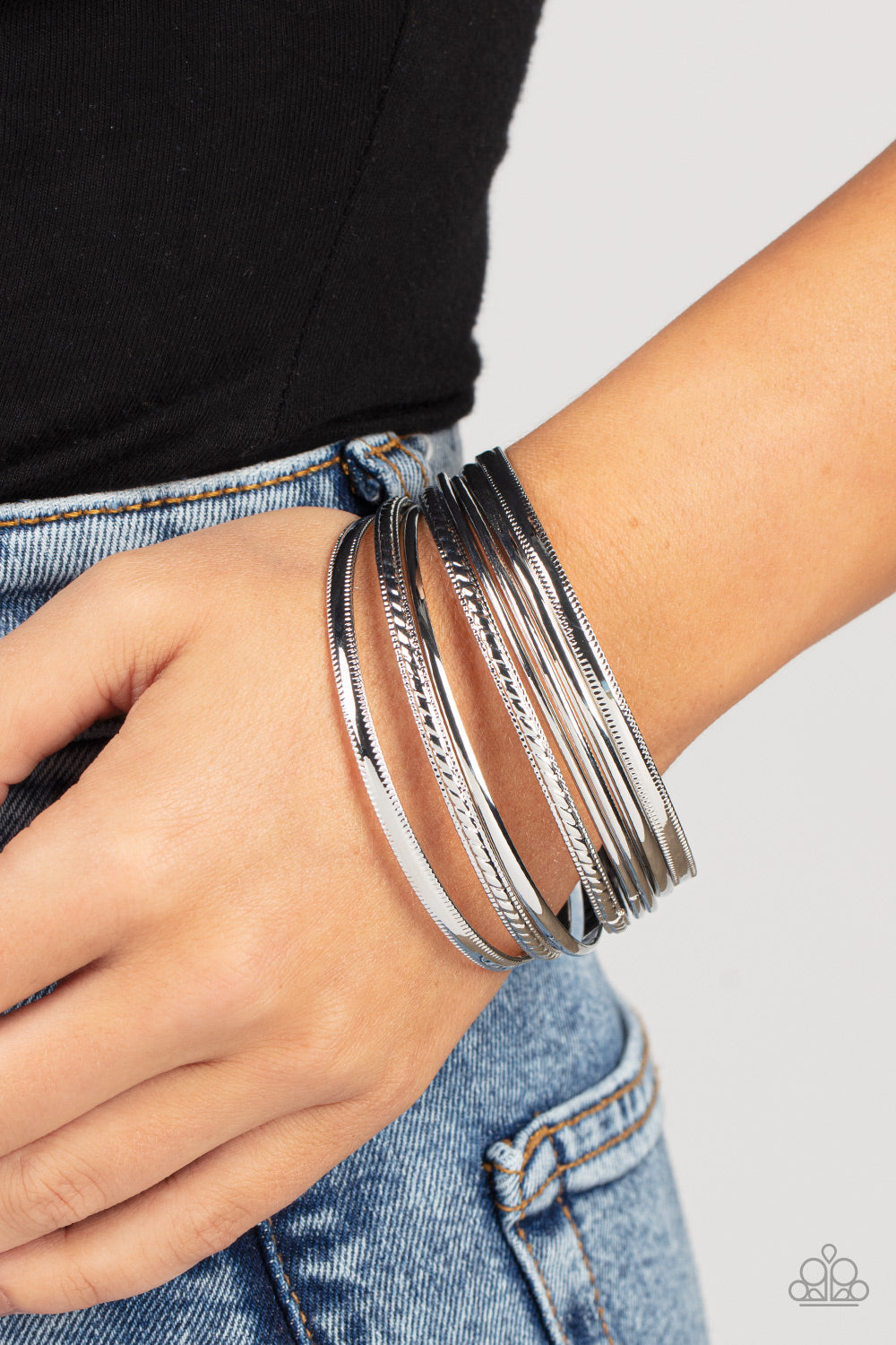 classic silver bangles, varying in smooth and textured finishes