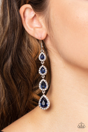 Bordered in dainty white rhinestones, glittery blue teardrop rhinestones gradually increase in size as they trickle from the ear