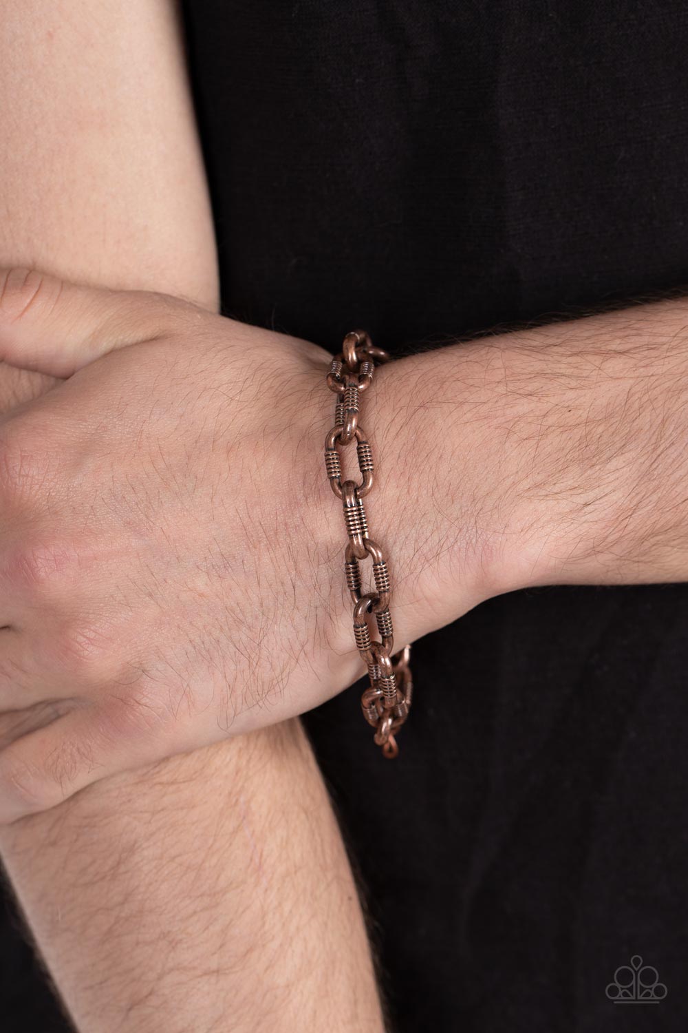 gritty texture, an oversized copper chain links around the wrist for an edgy urban look