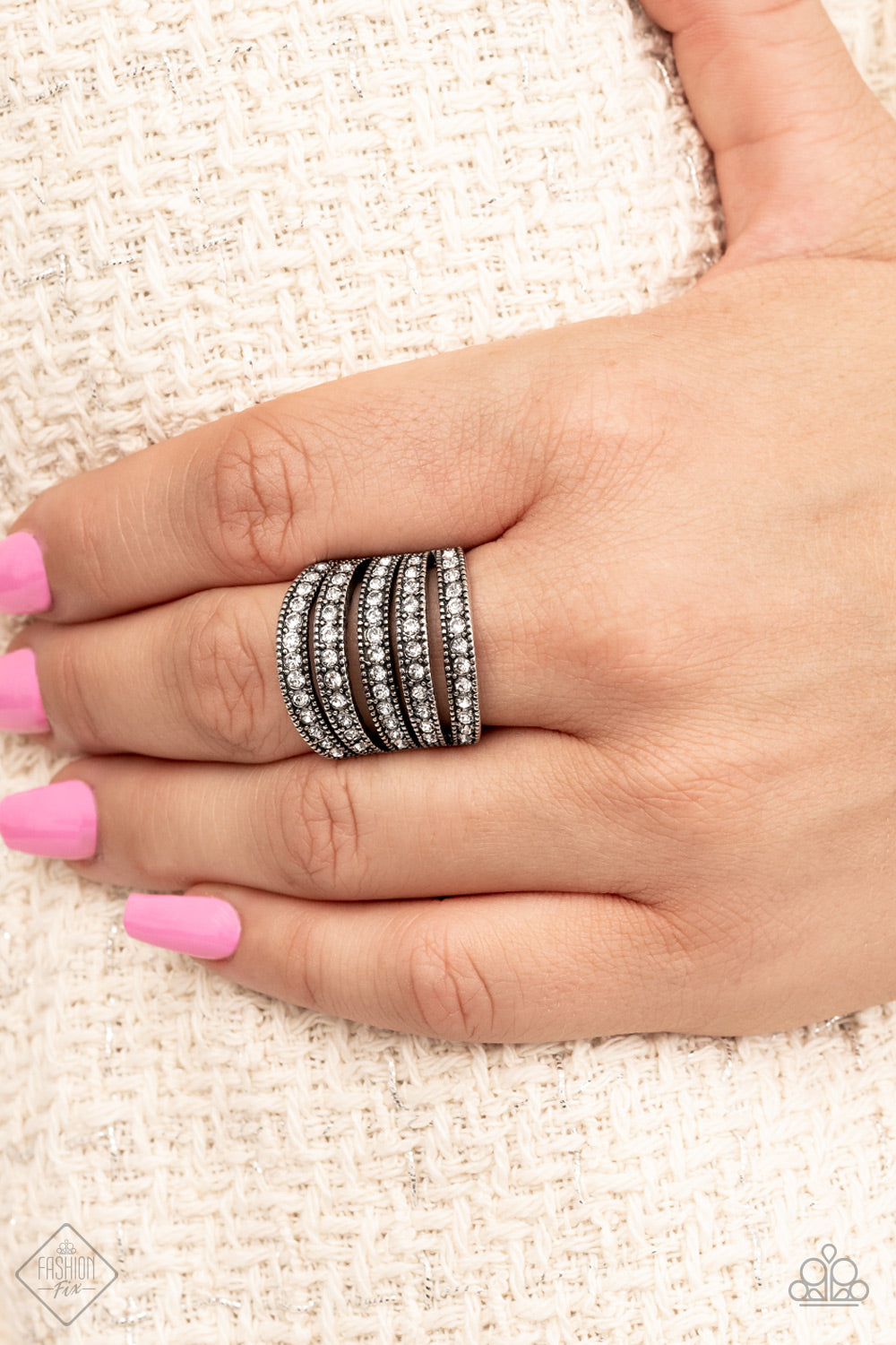 Row after row of blinding rhinestones are encased in subtle studded texture