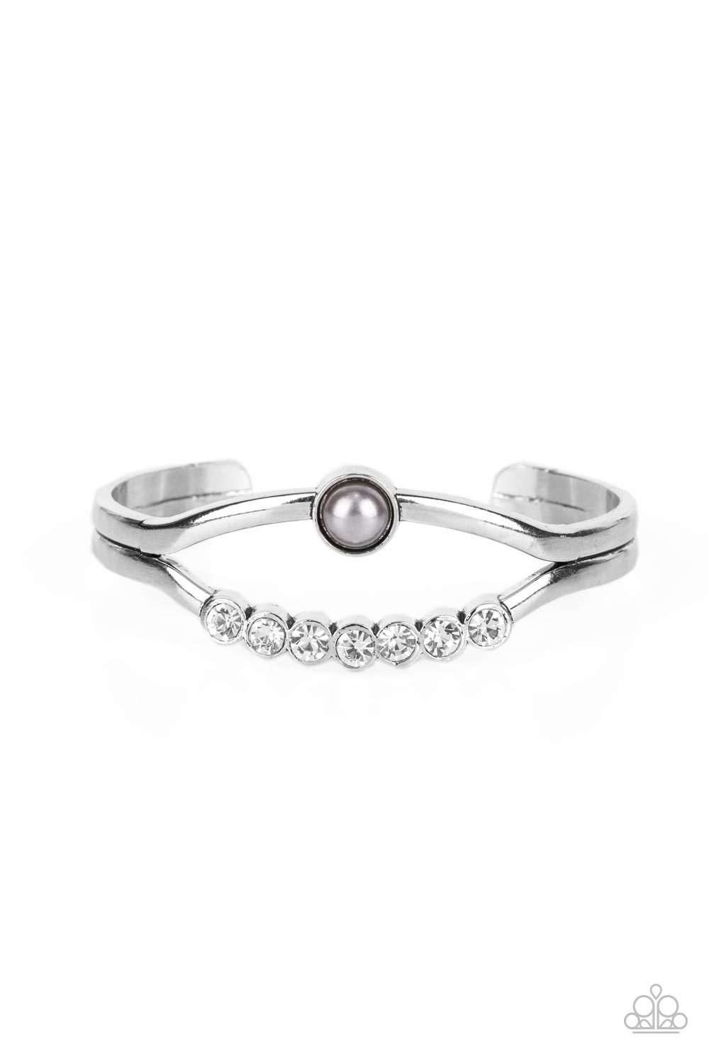 A row of white rhinestones and a solitaire silver pearl adorn the layered center of a classic silver cuff