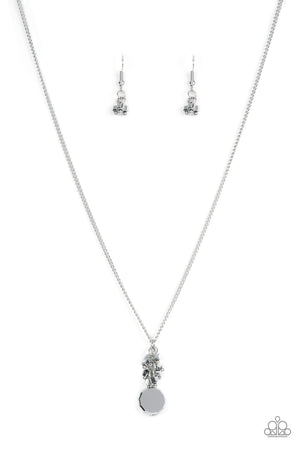 A faceted hematite gem-like bead swings from the bottom of a hematite beaded tassel, creating a twinkly pendant below the collar