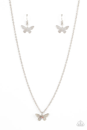 Layered with ornate silver wings, an iridescent pink rhinestone dotted butterfly flutters from a dainty silver chain below the collar 