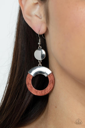 Capped in a curved silver plate, an earthy brown stone hoop swings from the bottom of a shiny silver disc for an authentic artisan twist